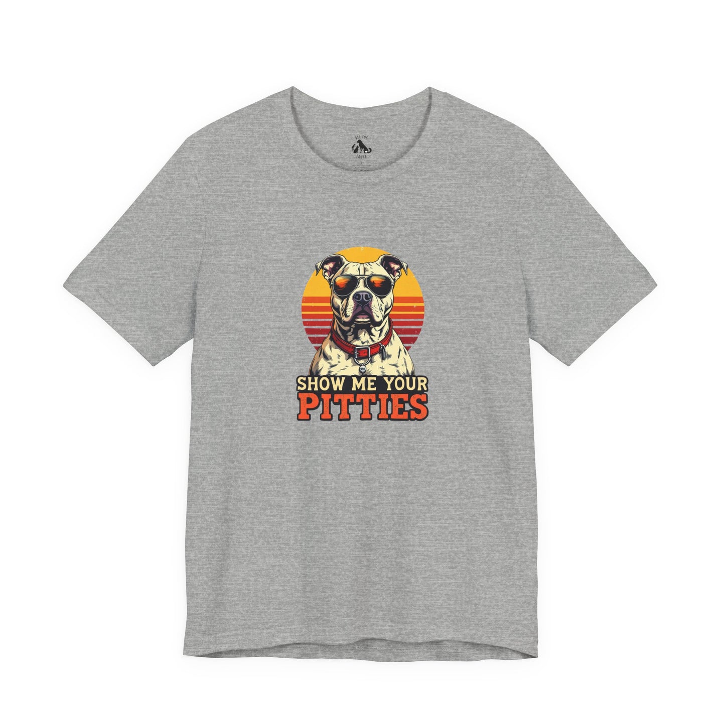 A heather gray short-sleeve t-shirt with a retro-style graphic of a pitbull dog wearing sunglasses in front of a sunset, with the text 'SHOW ME YOUR PITTIES' printed below.
